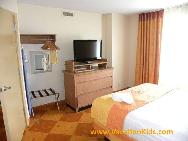 At Disney's Art of Animations Cars parents enjoy a private master bedroom with a privacy door, Queen bed and their own flat screen TV