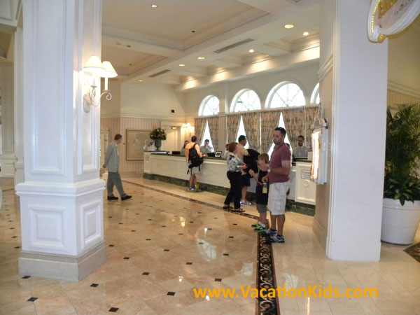 Cast members are waiting for your family to check in at Disney's Grand Floridian