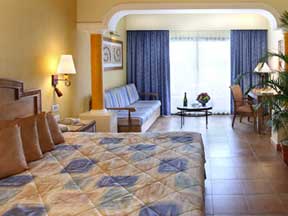Bright, cheerful, comfortable rooms await your family at the Barcelo Maya Tropical all inclusive resort