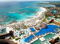 Enjoy over a mile of white sand beach front at the Barcelo Maya Palace Deluxe Resort in the Riveira Maya