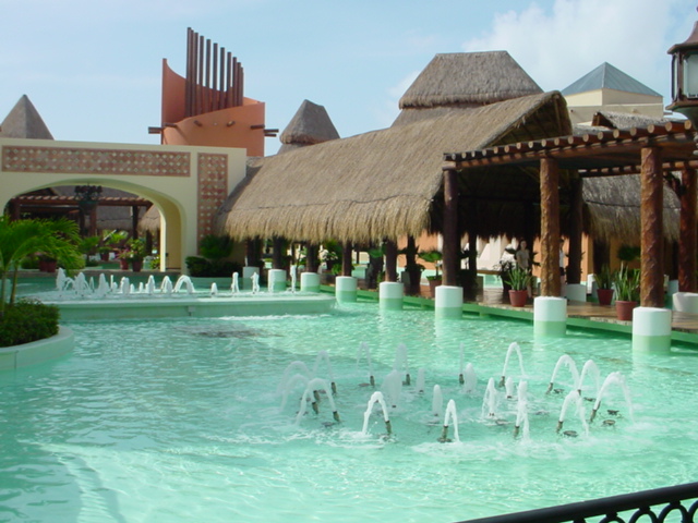 Iberostar Lindo resort grounds with water features and covered walk ways