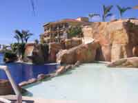 3 story water fall slide amidst the large pools at Hotel Marina El Cid
