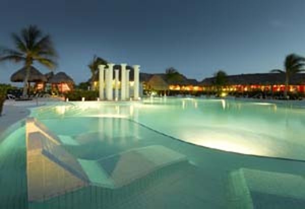 Night time view of one of 8 pools at the Grand Palladium Riviera Resort & Spa