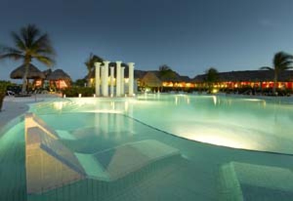 Grand Palladium Colonial resort pools glow at night
