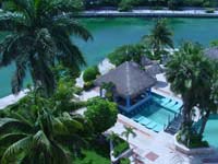 View of the Adult pool and swim up bar on the Marina side of Dreams Puerto Aventuras Resort