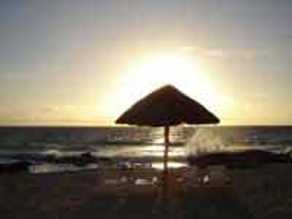 Sunset on the beach at Dreams Puerto Aventuras Resort in the Mayan Riviera