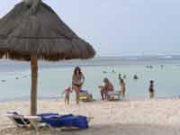 Family on the beach of the Oasis Palm Cancun Resort