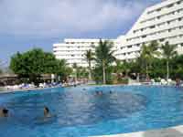 Oasis Palm Beach View of main building from poolside