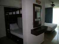 Family rooms at the Great Parnassus Resort & Spa where three kids can share the room with their parents - family of five friendly resort