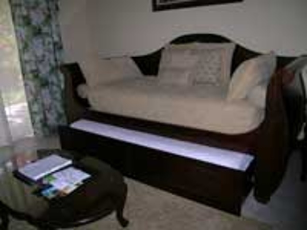 Mahogany trundle daybed sleeps two kids at Beaches Turks & Caicos