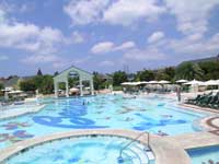 View of French village pool and whirlpools at Beaches Turks & Caicos Resort
