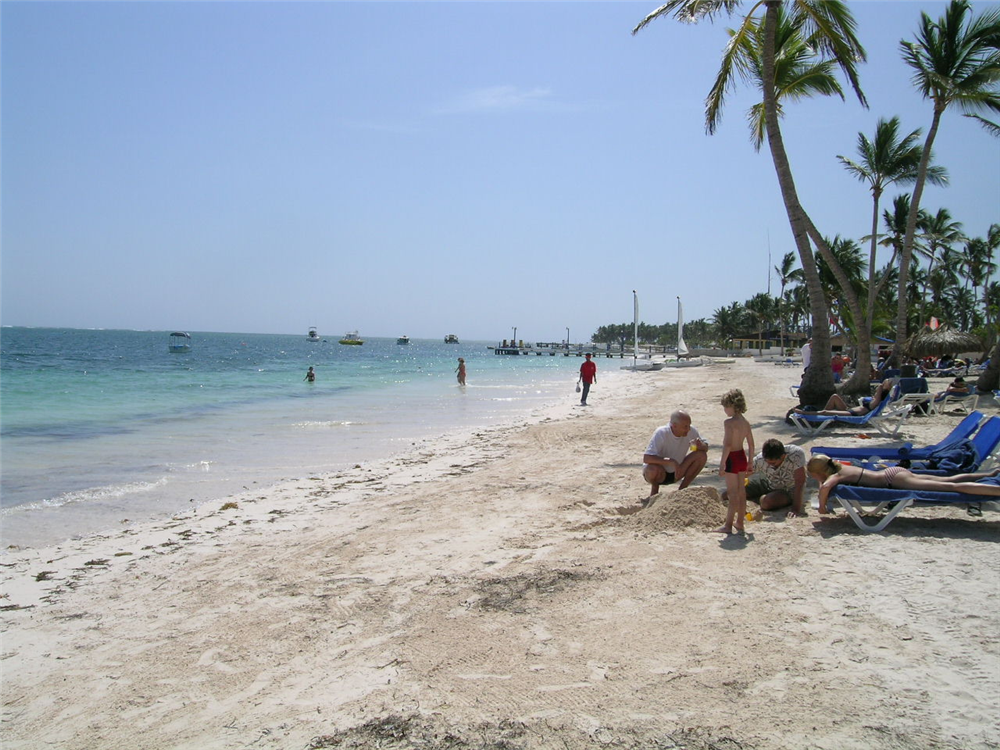 Families can spend hours creating sand castles int he sun at Dreams Palm Beach Punta Cana resort