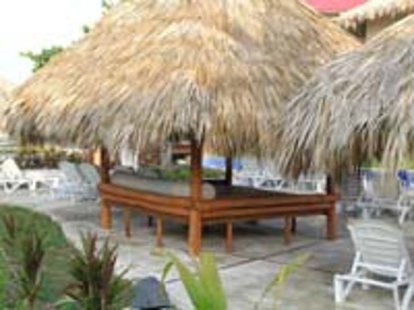 Family sized Beach beds line the lazy river pool at Dreams Punta Cana Resort