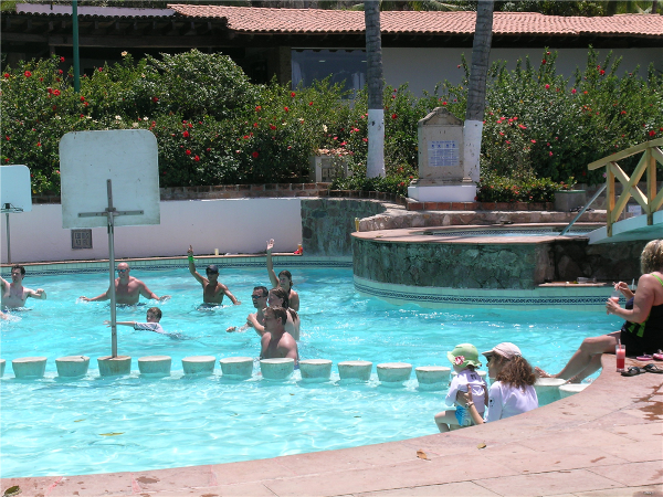 Main pool with swim up bar and kids swim area at Dreams Puerto Vallarta