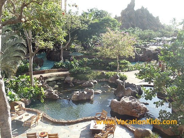 Enchanting koi fish ponds intertwine with the pool play areas in the Waikolohe valley at Disney Aulani