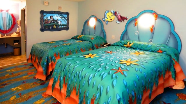 Art of Animation Little Mermaid standard rooms offer 277 square feet of living space with a dressing area near the sink that separates with a privacy curtain