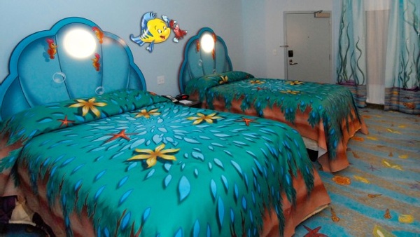 Disney Art of Animation Little Mermaid rooms offer two DOUBLE beds with clam headboards that will sleep a family of 4 plus one infant under the age of 3