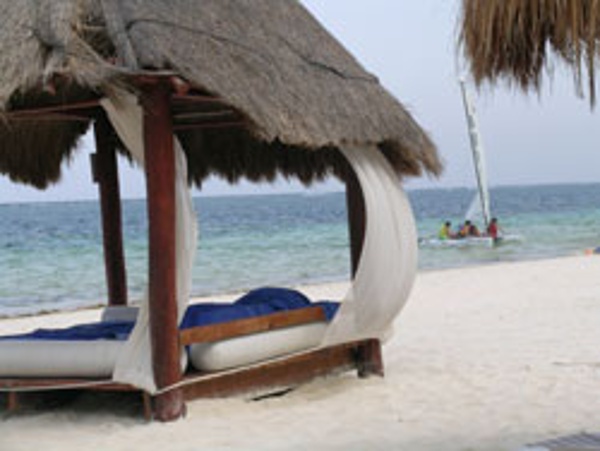 Relax on your own beach bed at Azul Beach Resort Hotel with your family