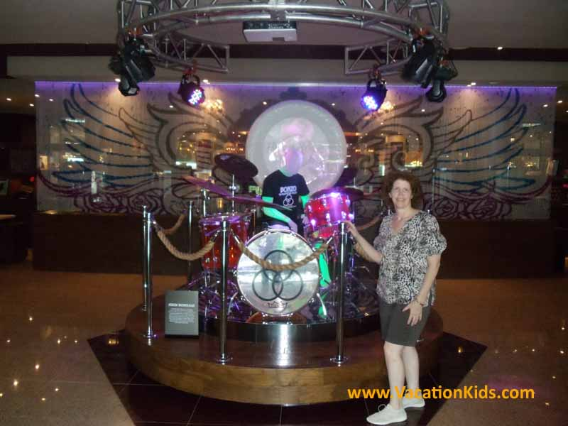 Vacationkids Sally Black with Led Zepplin's drum set in the lobby of the Hard Rock Cancun Hotel