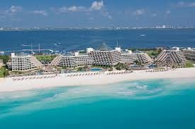 Ocean view of the 5 pyramid buildings of the Paradisus Cancun all inclusive resort.