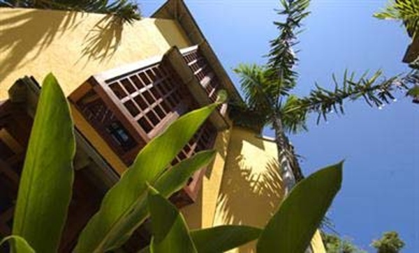 Beautiful lush tropical grounds with Classic Caribbean architecture await your family at Beaches Negril