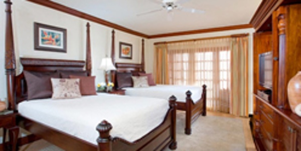Rooms at Beaches Negril are elegantly appointed with mahogany furnishings