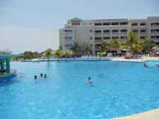 Huge Infinity pool with swim up bar at Iberostar Rose Hall beach Resort in Jamaica