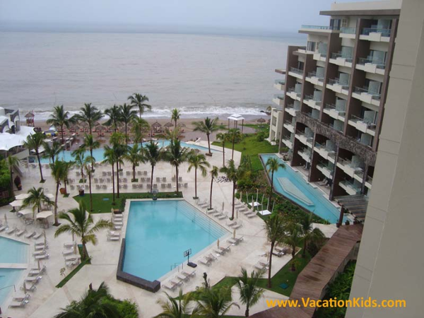 View of the grounds and pool at Now Amber Puerto Vallarta resort