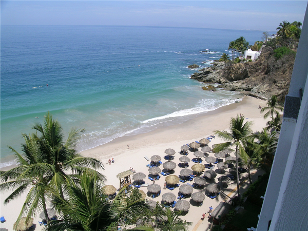 view of the right side of the beach from our room at Dreams Puerto Vallarta overlooking the bay of Banderas