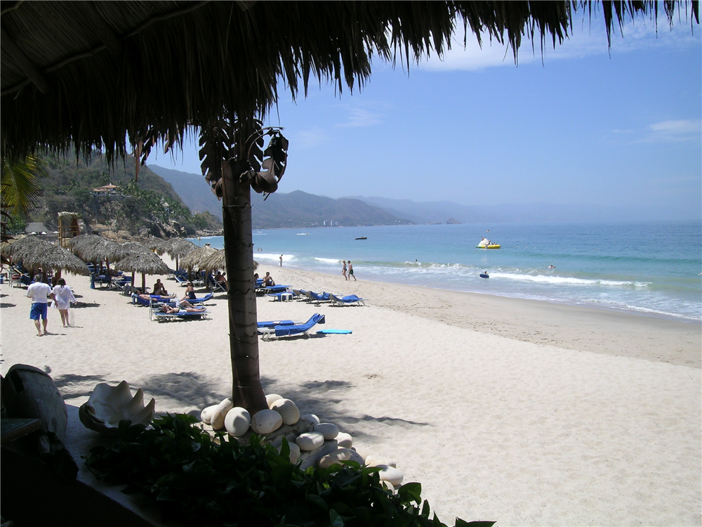 Kick back in shady spot or enjoy the sunshine on the beach of Dreams Puerto Vallarta with your family